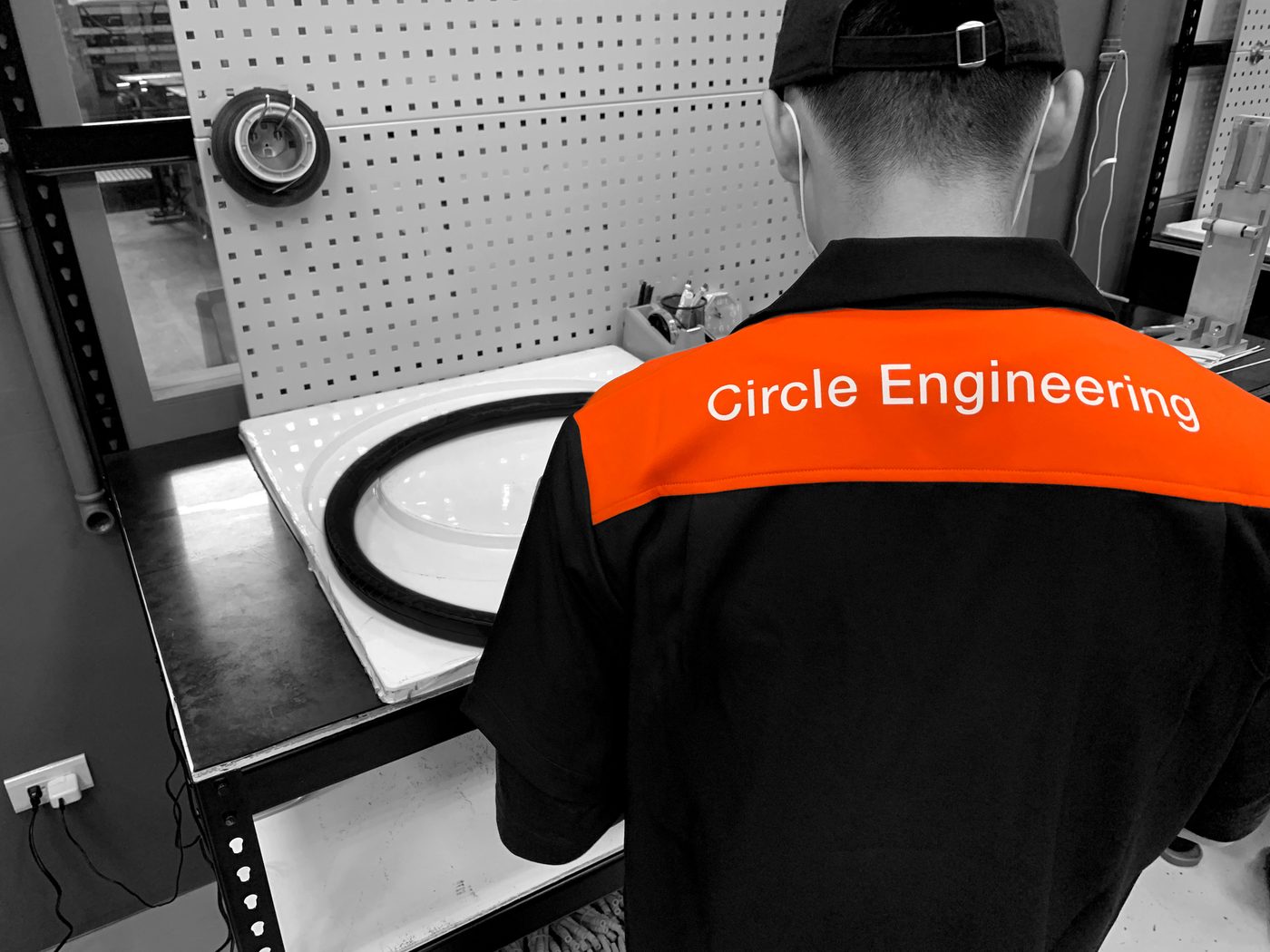 Circle Engineering technician working on an in-house carbon fiber rim